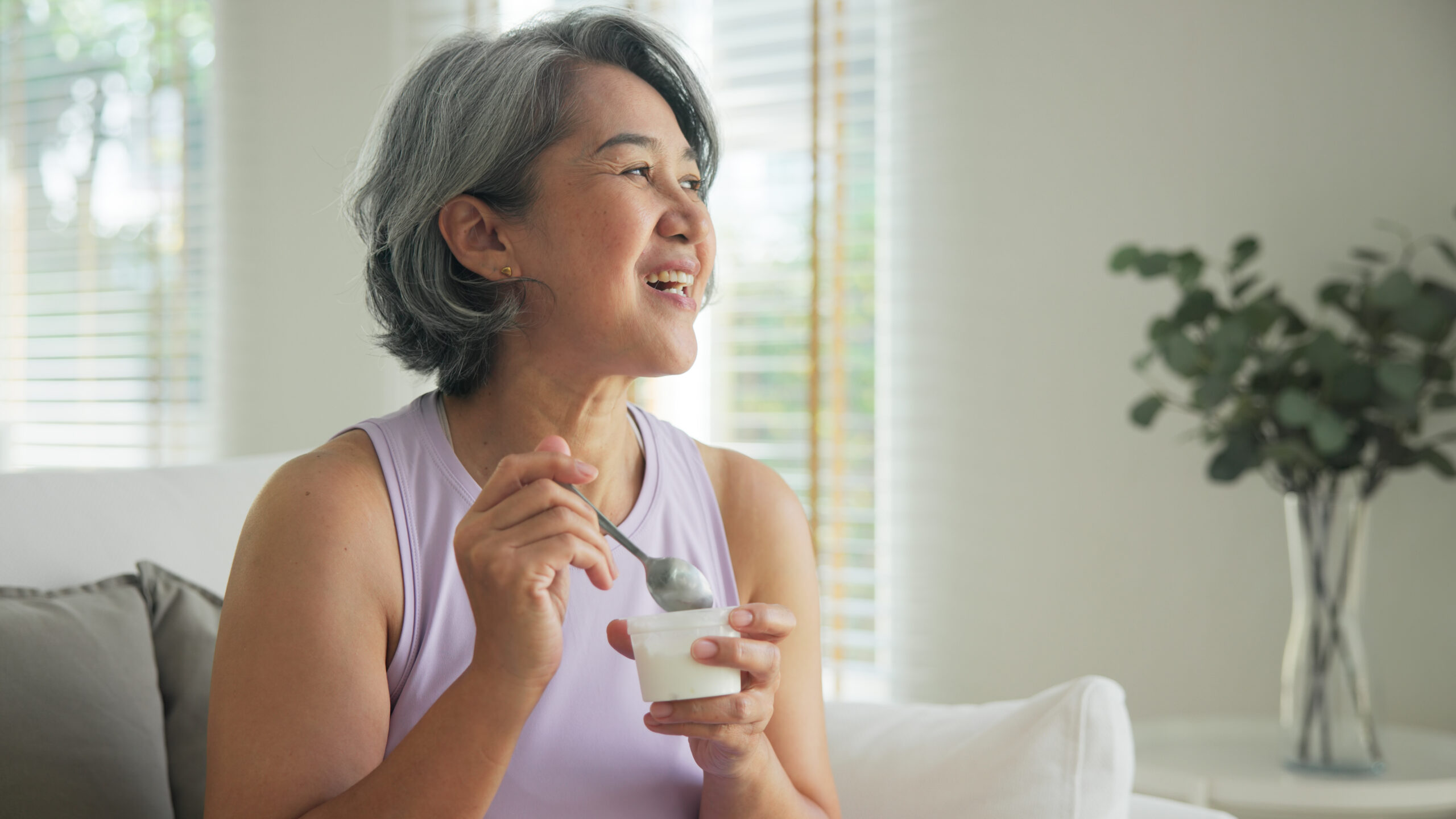 A mature lady looks happy and energised