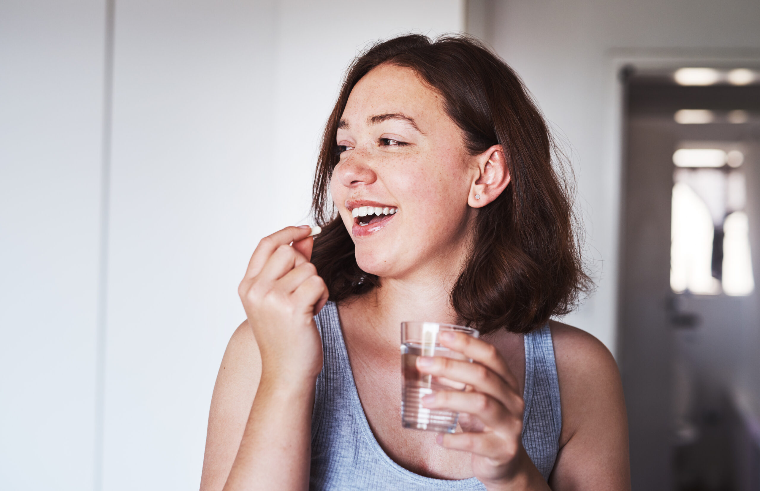 Lady taking zinc supplement